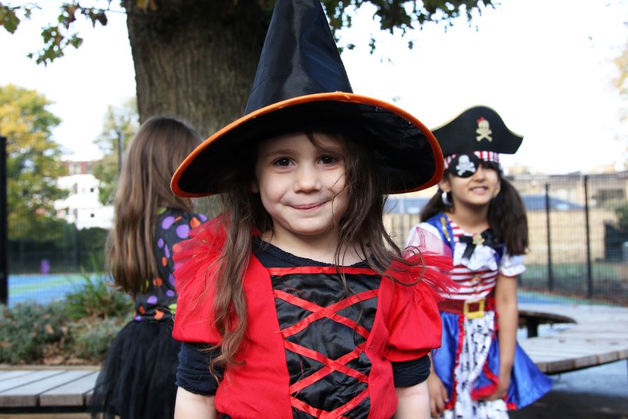 child in witch costume